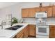 Kitchen featuring modern sink, countertop, and updated appliances for efficient cooking at 3921 E Runaway Bay Pl, Chandler, AZ 85249