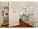 Bedroom featuring shuttered windows, wood flooring, a mirrored closet, and natural light at 4138 E Indigo St, Gilbert, AZ 85298