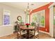 Cozy dining room with a round wooden table, chandelier, and bright window views at 4138 E Indigo St, Gilbert, AZ 85298