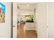 Entryway leading to a kitchen featuring a large aquarium and an open-concept dining area at 4138 E Indigo St, Gilbert, AZ 85298