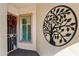 Cozy entryway decorated with seasonal wreath and decorative tree of life sculpture at 4138 E Indigo St, Gilbert, AZ 85298