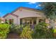 Charming home showcasing a covered patio perfect for outdoor relaxation and entertaining, surrounded by lush landscaping at 4138 E Indigo St, Gilbert, AZ 85298