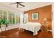 Serene main bedroom featuring ample natural light, a ceiling fan, and stylish decor at 4138 E Indigo St, Gilbert, AZ 85298