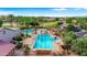 Overhead shot of a large pool with cabana, lounge areas, and a bocce court at 4138 E Indigo St, Gilbert, AZ 85298