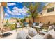 Inviting backyard featuring a lounge area, desert plants, and privacy at 4151 E Mercer Ln, Phoenix, AZ 85028