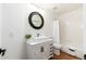 Bathroom with modern vanity, sleek mirror, and a combined shower and tub at 4151 E Mercer Ln, Phoenix, AZ 85028