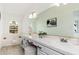 Bright bathroom featuring double sinks, a large mirror, and natural light at 4151 E Mercer Ln, Phoenix, AZ 85028