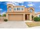 Beautiful two-story home featuring a Spanish tile roof and an attached two-car garage at 4151 E Mercer Ln, Phoenix, AZ 85028