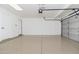 Spacious garage with epoxy flooring and ample room for parking and storage at 4151 E Mercer Ln, Phoenix, AZ 85028