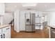 Kitchen view showcasing the stainless steel refrigerator and custom cabinetry at 4151 E Mercer Ln, Phoenix, AZ 85028