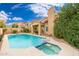 Backyard pool and spa with desert landscaping at 4151 E Mercer Ln, Phoenix, AZ 85028