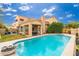 Backyard with a pool and seating area; perfect for outdoor relaxation and entertaining at 4151 E Mercer Ln, Phoenix, AZ 85028