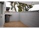 Private backyard area featuring minimalist design and a secure concrete block wall at 4206 N 38Th St # 3, Phoenix, AZ 85018