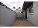 Cozy backyard patio with umbrella, lounge chairs, and attractive privacy wall; perfect for outdoor entertaining at 4206 N 38Th St # 3, Phoenix, AZ 85018