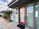 Front door of condo featuring bright red door, large windows and desert landscaping at 4206 N 38Th St # 3, Phoenix, AZ 85018