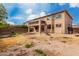 Expansive backyard featuring a multi-story home with a balcony and ample outdoor area at 45105 W Horse Mesa Rd, Maricopa, AZ 85139