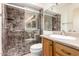 Bathroom with dark marbled shower and a single sink vanity provides ample space at 4701 E Voltaire Ave, Phoenix, AZ 85032