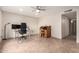 Versatile bedroom with neutral walls, tile floor, a ceiling fan and ample space for an office at 4701 E Voltaire Ave, Phoenix, AZ 85032