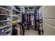 This walk in closet has custom built in shelving, hardwood floors and ample storage at 4705 E Betty Elyse Ln, Phoenix, AZ 85032