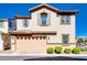 Attractive home showcasing a large garage and neutral colored facade with contrasting brown trim at 4705 E Betty Elyse Ln, Phoenix, AZ 85032