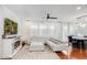 Bright living room showcasing a plush sectional, fireplace, and hardwood floors at 4705 E Betty Elyse Ln, Phoenix, AZ 85032