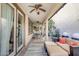 This covered patio features an outdoor lounge area and modern ceiling fans at 4705 E Betty Elyse Ln, Phoenix, AZ 85032