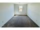 Spacious carpeted bedroom featuring a window, providing ample natural light at 47248 W Cansados Rd, Maricopa, AZ 85139