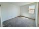 Carpeted bedroom with a window allowing natural light to brighten the space at 47248 W Cansados Rd, Maricopa, AZ 85139