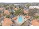 Aerial view of the community pool with lounge chairs and umbrellas surrounded by townhomes at 4901 E Kelton Ln # 1227, Scottsdale, AZ 85254