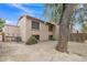 View of the backyard of the home showing a tree and air conditioning unit at 4901 E Kelton Ln # 1227, Scottsdale, AZ 85254