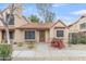 Charming single-story home with a tile roof, desert landscaping, and a welcoming front door at 4901 E Kelton Ln # 1227, Scottsdale, AZ 85254