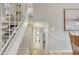 Hallway with a staircase leading to multiple floors, and a view into a bathroom, offering seamless navigation at 4901 E Kelton Ln # 1227, Scottsdale, AZ 85254