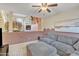 Cozy living room with plush gray sofa and ottoman and a fireplace on the level above at 4901 E Kelton Ln # 1227, Scottsdale, AZ 85254