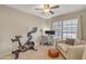 Bright home office with a Peloton bike and a comfortable workstation setup at 4901 E Kelton Ln # 1227, Scottsdale, AZ 85254