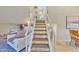 Bright staircase with white railings leading upstairs to a bathroom and bedroom at 4901 E Kelton Ln # 1227, Scottsdale, AZ 85254