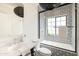 Stylish bathroom featuring black and white patterned tile, modern fixtures, and a separate tub and shower at 5137 E Flower St, Phoenix, AZ 85018