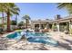 Inviting backyard pool area with a unique pool design, lounge seating, and lush landscaping at 5137 E Flower St, Phoenix, AZ 85018