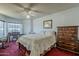 Spacious main bedroom with ceiling fan, bay window, and lots of natural light features a vintage aesthetic at 5230 E Brown Rd # C117, Mesa, AZ 85205