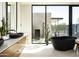 Modern bathroom with dual vanities, sleek fixtures, and a freestanding tub for a spa-like experience at 5287 N Invergordon Rd, Paradise Valley, AZ 85253