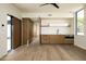 Bonus room features wood accents and cabinetry with sink and countertop space at 5287 N Invergordon Rd, Paradise Valley, AZ 85253