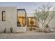 View of front exterior featuring xeriscape landscaping at 5287 N Invergordon Rd, Paradise Valley, AZ 85253