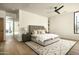 View of the spacious bedroom featuring hardwood flooring, area rug and ceiling fan at 5287 N Invergordon Rd, Paradise Valley, AZ 85253