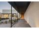 Covered walkway leading to the home's entrance, featuring sleek design elements and desert landscaping at 5287 N Invergordon Rd, Paradise Valley, AZ 85253