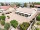 An aerial view showcases a well-maintained property with desert landscaping and a covered patio at 6050 S Crosscreek Ct, Chandler, AZ 85249