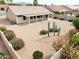 Aerial view of backyard with desert landscaping, covered patio, and privacy fence at 6050 S Crosscreek Ct, Chandler, AZ 85249