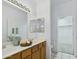 Bathroom featuring a double sink vanity and a door leading to the walk-in closet at 6050 S Crosscreek Ct, Chandler, AZ 85249