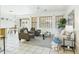 Open-concept living area featuring neutral decor, tile floors, and a seamless flow to the dining area at 6050 S Crosscreek Ct, Chandler, AZ 85249