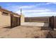 Spacious backyard with fencing, gravel, and concrete, offering plenty of space at 61 S 111Th Pl, Mesa, AZ 85208