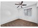 Cozy bedroom with carpet, a ceiling fan, and window with blinds for comfortable living at 61 S 111Th Pl, Mesa, AZ 85208