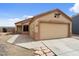 Charming single-story home with a two-car garage and low maintenance landscaping at 61 S 111Th Pl, Mesa, AZ 85208